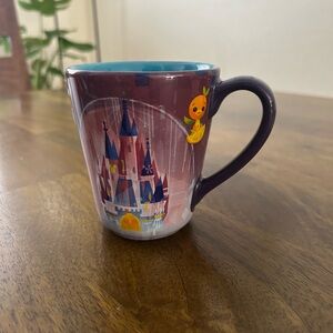 Disney Parks mug by artist Joey Chou. 
The mug features Cinderella's Castle.